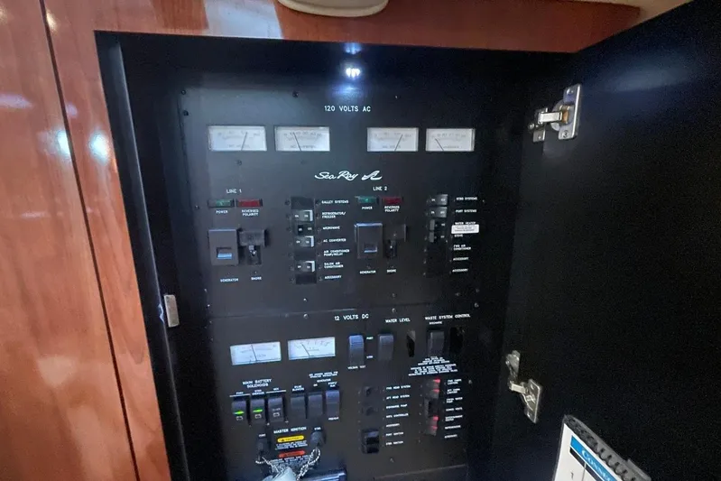 Irish Rover Yacht Photos Pics Electrical control panel of 2006 Sea Ray 360 Sundancer boat, featuring various switches and gauges.