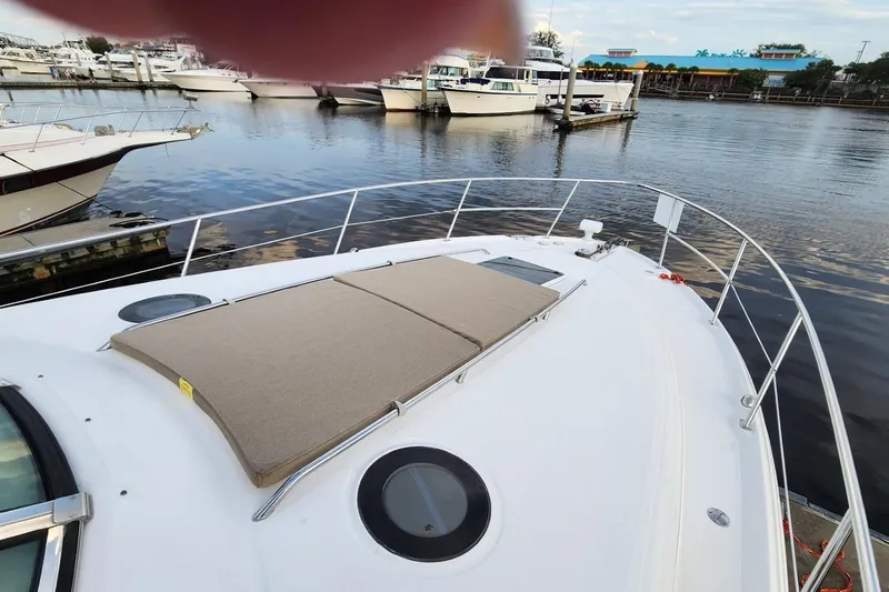 Irish Rover Yacht Photos Pics 2006 Sea Ray 360 Sundancer yacht docked at marina, featuring sunpad and sleek design.