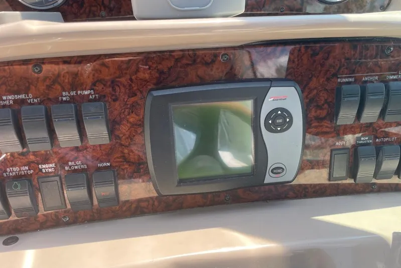 Irish Rover Yacht Photos Pics Control panel of a 2006 Sea Ray 360 Sundancer boat with switches and display.
