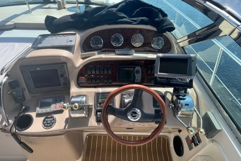Irish Rover Yacht Photos Pics Cockpit of 2006 Sea Ray 360 Sundancer with navigation instruments and steering wheel.