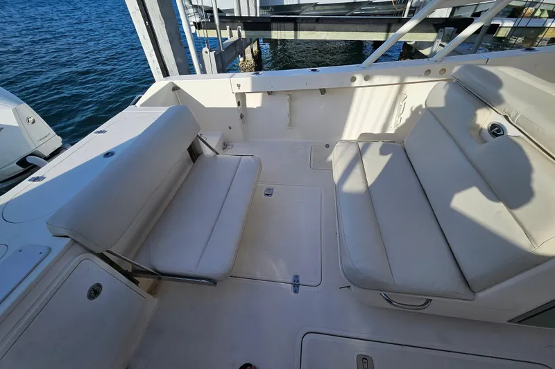  Yacht Photos Pics 2012 Pursuit C 310 Center Console boat interior with cushioned seating.