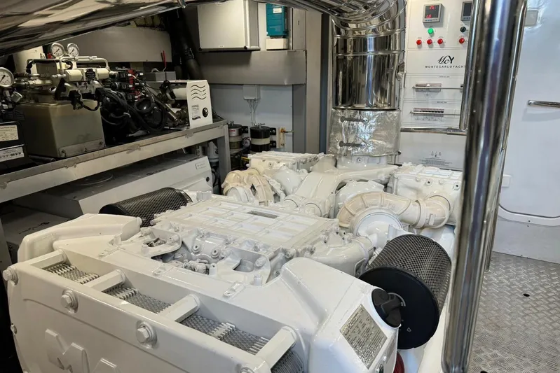 Illuzion Yacht Photos Pics Engine room of 2020 Monte Carlo Yachts MCY 70, showcasing advanced machinery and controls.