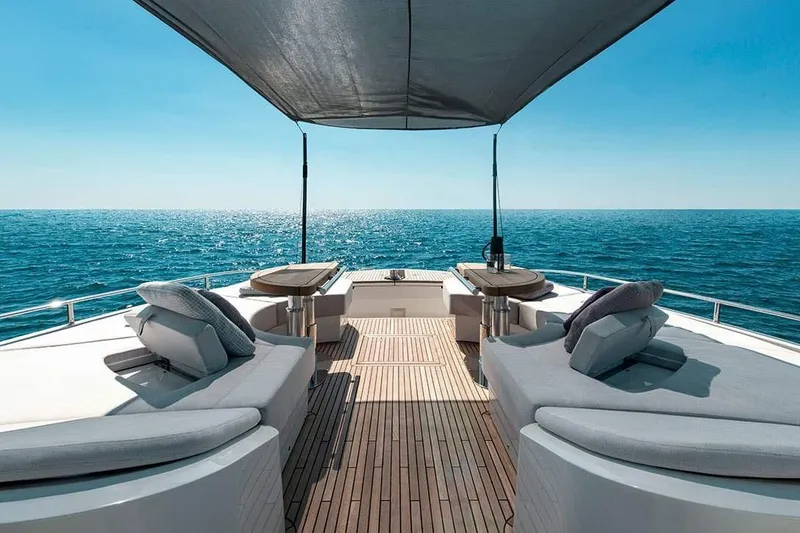 Illuzion Yacht Photos Pics Luxurious 2020 Monte Carlo Yachts MCY 70 deck with sun loungers and ocean view.