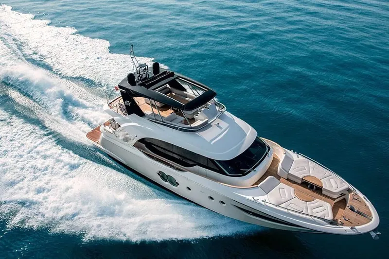 Illuzion Yacht Photos Pics Luxury Monte Carlo Yachts MCY 70 cruising on open water, 2020 model.