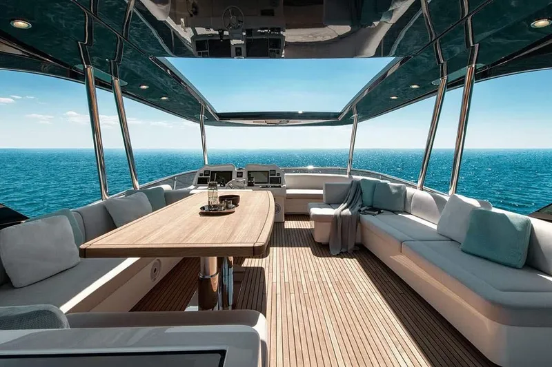 Illuzion Yacht Photos Pics Luxurious 2020 Monte Carlo Yachts MCY 70 deck with ocean view and elegant seating.