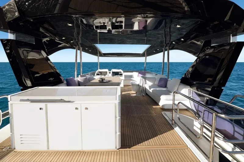 Illuzion Yacht Photos Pics Luxurious 2020 Monte Carlo Yachts MCY 70 deck with elegant seating and ocean view.
