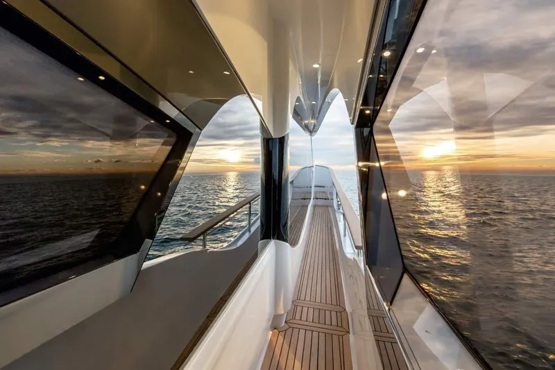Illuzion Yacht Photos Pics Luxurious Monte Carlo Yachts MCY 70, 2020 model, with stunning ocean sunset view.