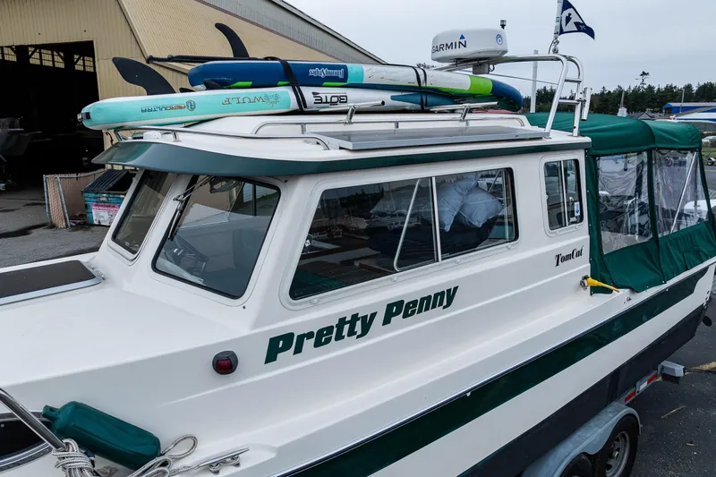 Pretty Penny Yacht Photos Pics 2006 C-Dory 25' Tomcat Catamaran with paddleboards on roof, named "Pretty Penny."