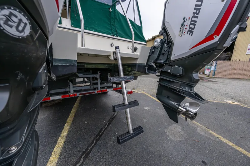 Pretty Penny Yacht Photos Pics 2006 C-Dory 25' Tomcat Catamaran with outboard motors and ladder on trailer.