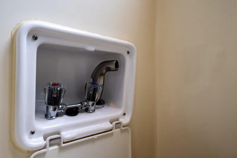 Pretty Penny Yacht Photos Pics 2006 C-Dory 25' Tomcat Catamaran interior faucet with dual handles and spout.