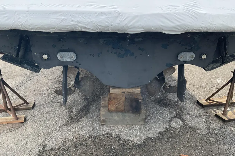 Son Days Yacht Photos Pics 2006 Tiara Yachts 3800 Open boat hull and propellers on stands.