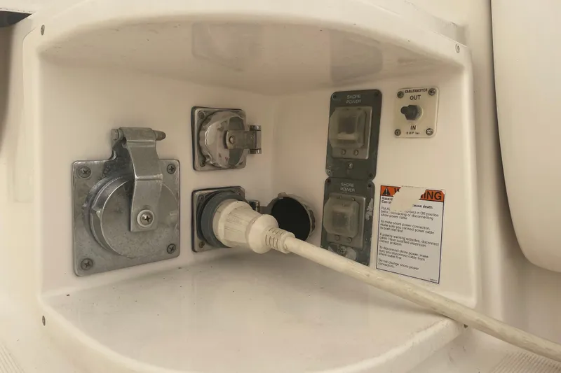 Son Days Yacht Photos Pics Electrical panel on a 2006 Tiara Yachts 3800 Open, featuring shore power connections.