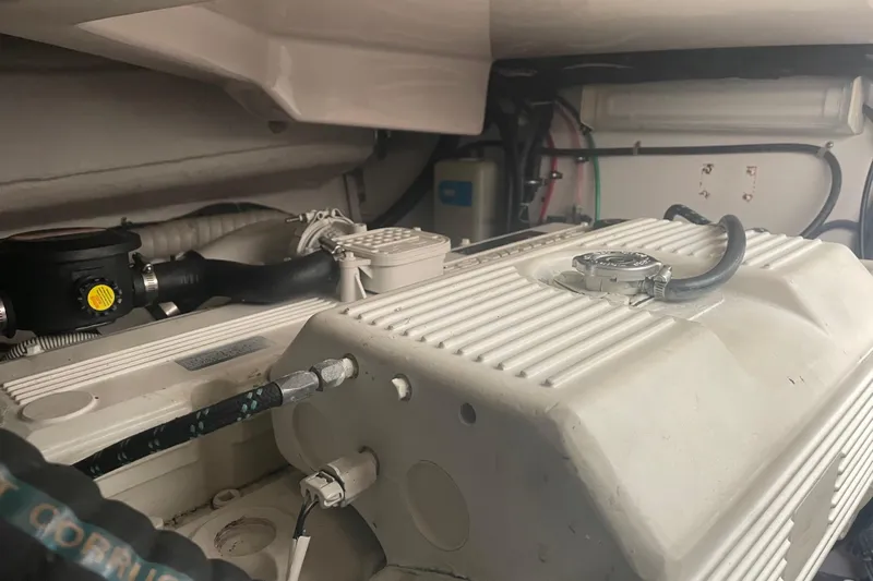 Son Days Yacht Photos Pics Engine compartment of a 2006 Tiara Yachts 3800 Open, showcasing mechanical components.