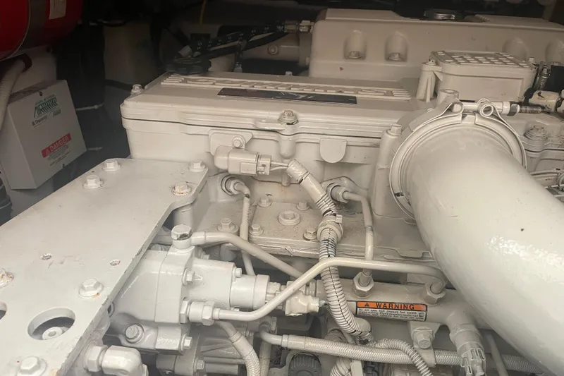 Son Days Yacht Photos Pics Engine compartment of a 2006 Tiara Yachts 3800 Open, showcasing detailed mechanical components.