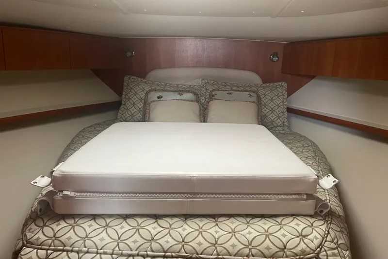 Son Days Yacht Photos Pics Interior cabin of 2006 Tiara Yachts 3800 Open with patterned bedding and cushions.