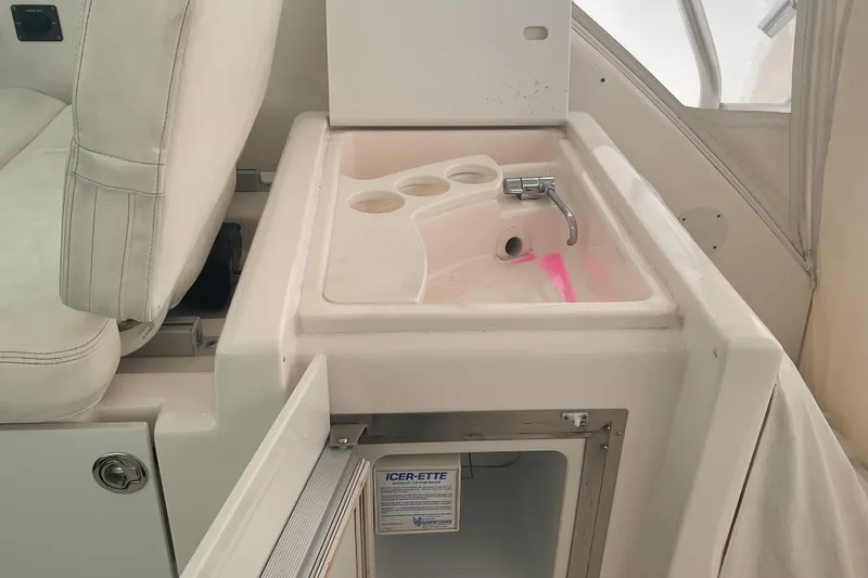 Son Days Yacht Photos Pics Interior of 2006 Tiara Yachts 3800 Open featuring sink and seating area.