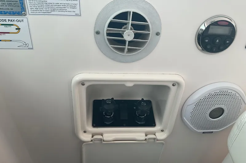 Son Days Yacht Photos Pics Control panel on a 2006 Tiara Yachts 3800 Open, featuring dials and speaker.