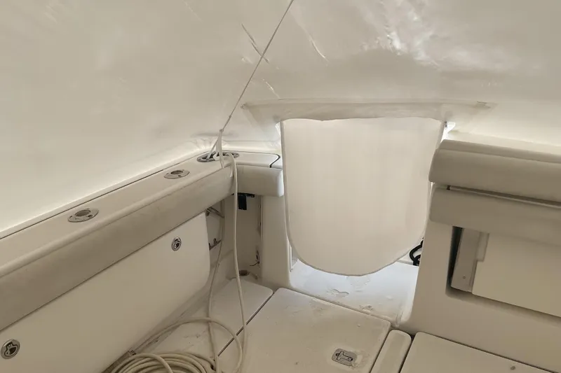 Son Days Yacht Photos Pics 2006 Tiara Yachts 3800 Open interior with white seating and storage compartments.