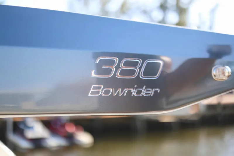  Yacht Photos Pics Close-up of 2025 VALIATT YACHTS 380 Bowrider logo on sleek blue surface.