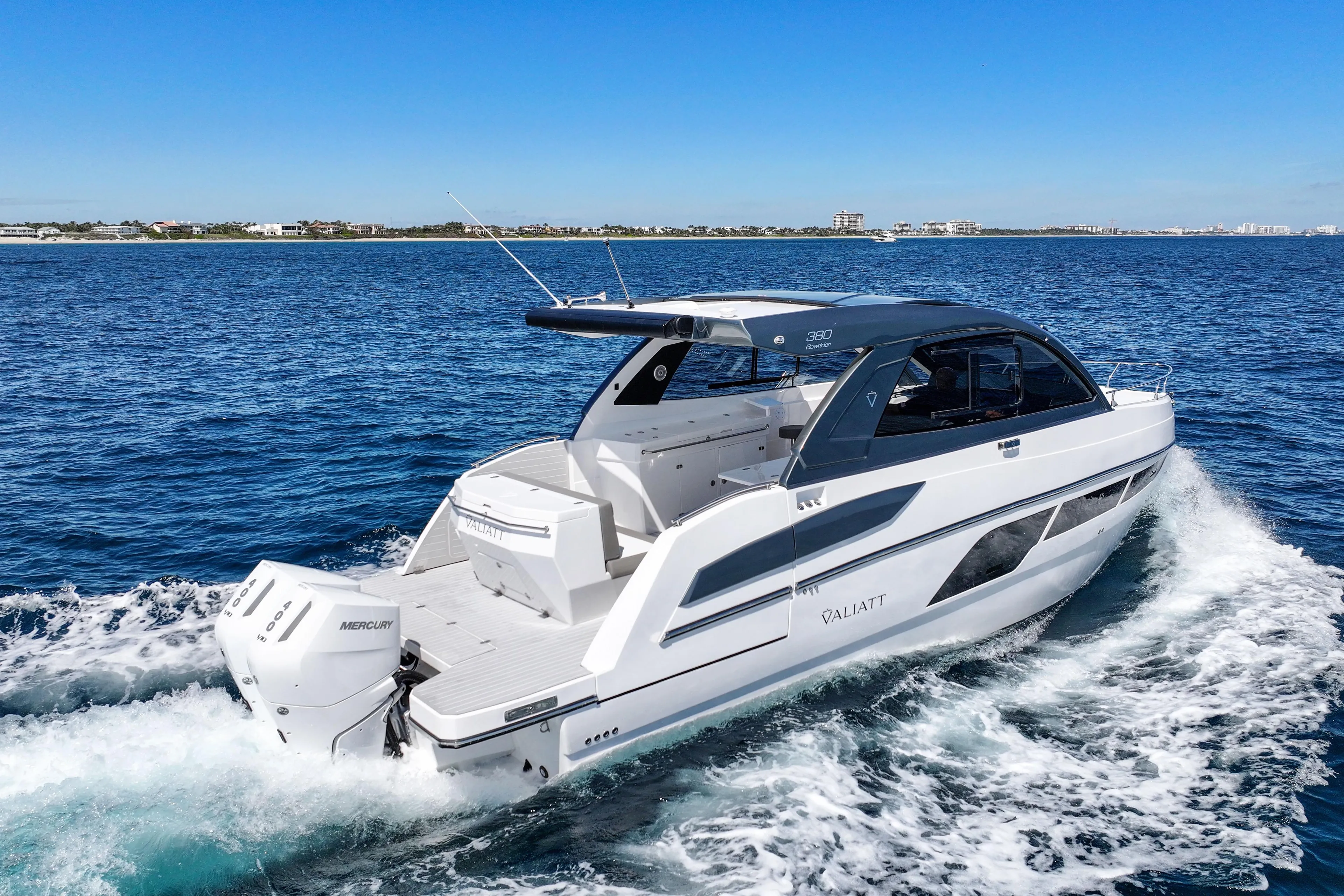 2025 VALIATT YACHTS 380 Bowrider cruising on open water under clear blue skies.