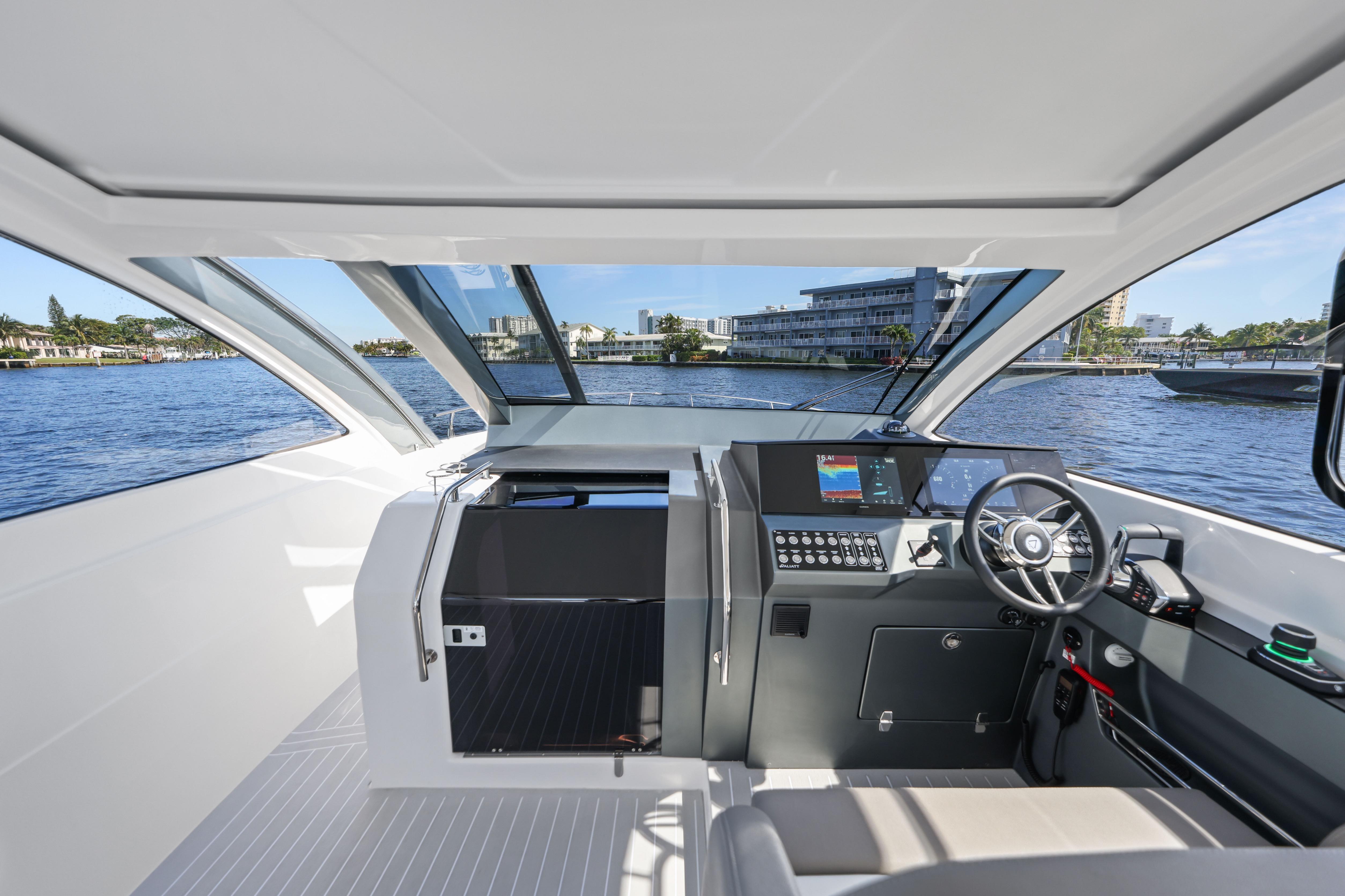 Interior view of 2025 VALIATT YACHTS 380 Bowrider, featuring modern helm and waterfront backdrop.