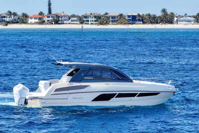  Yacht Photos Pics 2025 VALIATT YACHTS 380 Bowrider cruising on blue ocean near sandy beach.