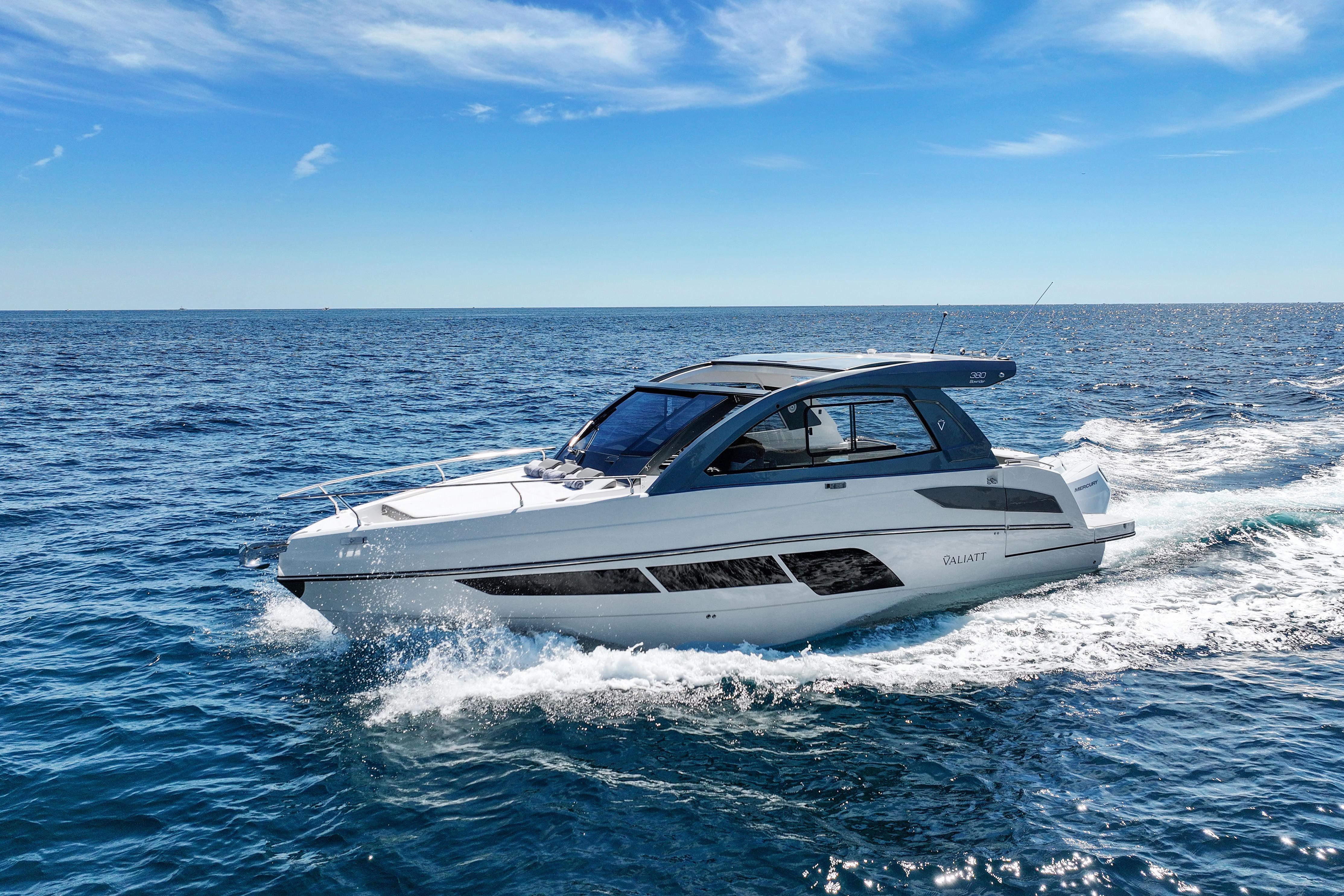 2025 VALIATT YACHTS 380 Bowrider cruising on open sea under clear blue sky.