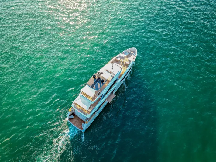  Yacht Photos Pics 2024 Sanlorenzo SD118 yacht cruising on clear blue ocean waters.