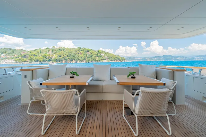  Yacht Photos Pics Luxurious 2024 Sanlorenzo SD118 yacht deck with elegant seating and ocean view.