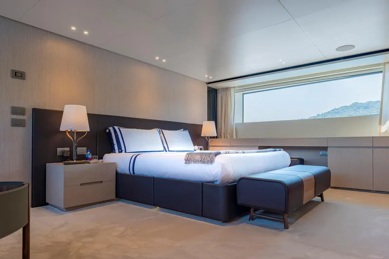  Yacht Photos Pics Luxurious bedroom interior on 2024 Sanlorenzo SD118 yacht with modern design and large window view.