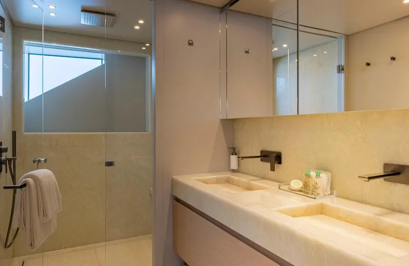  Yacht Photos Pics Luxurious bathroom in 2024 Sanlorenzo SD118 yacht with dual sinks and glass shower.