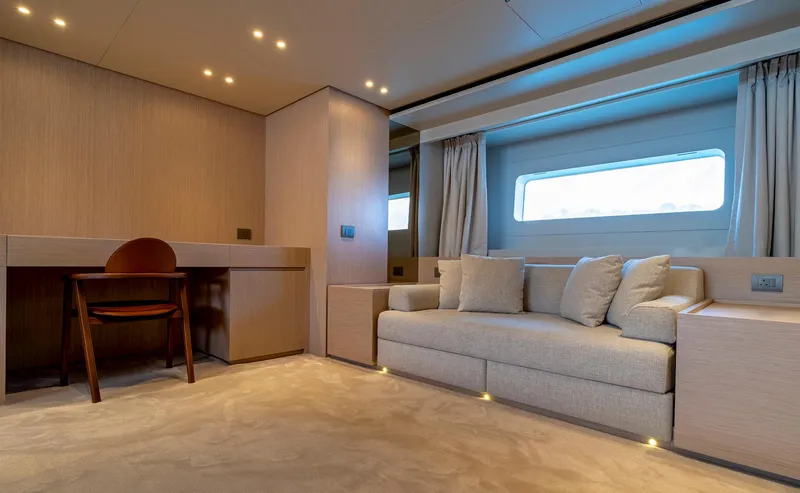  Yacht Photos Pics Luxurious interior of 2024 Sanlorenzo SD118 yacht with modern sofa and desk.