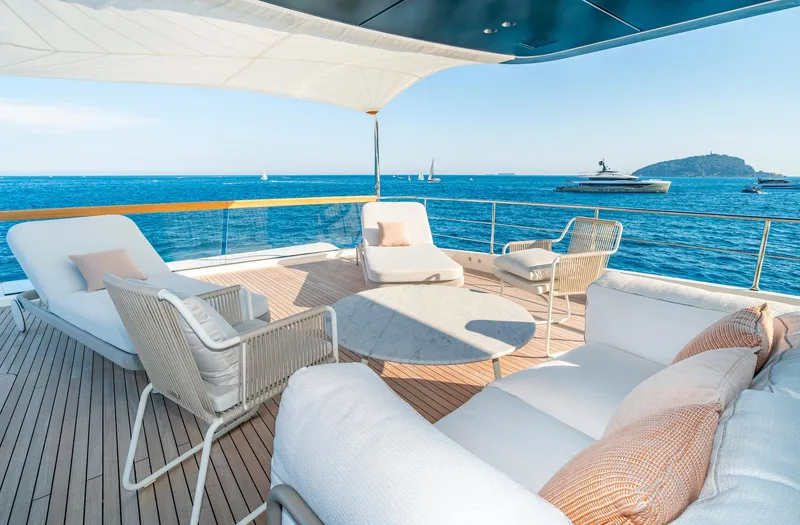  Yacht Photos Pics Luxurious 2024 Sanlorenzo SD118 yacht deck with elegant seating and ocean view.