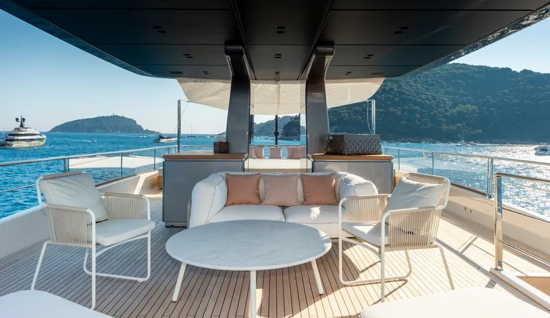  Yacht Photos Pics Luxurious 2024 Sanlorenzo SD118 yacht deck with elegant seating and ocean view.