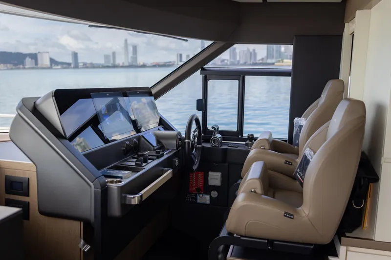Seahawk Yacht Photos Pics 2025 Azimut Magellano 66 yacht cockpit with modern navigation controls and luxurious seating.