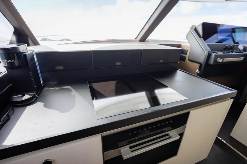 Seahawk Yacht Photos Pics Modern kitchen area in 2025 Azimut Magellano 66 yacht with sleek appliances.