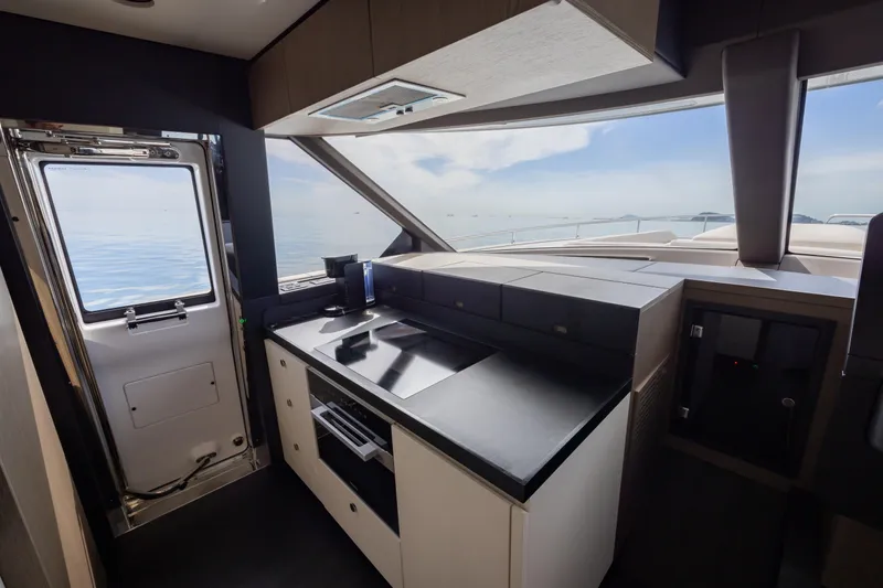 Seahawk Yacht Photos Pics Modern kitchen interior on 2025 Azimut Magellano 66 yacht with ocean view.