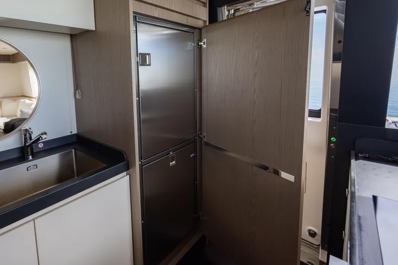 Seahawk Yacht Photos Pics Modern kitchen area on 2025 Azimut Magellano 66 yacht with stainless steel appliances.