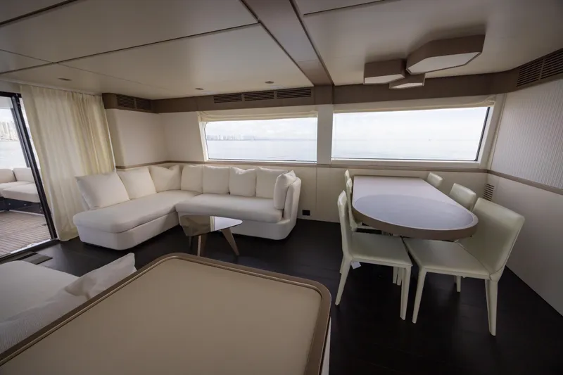 Seahawk Yacht Photos Pics Luxurious interior of 2025 Azimut Magellano 66 yacht with elegant seating and dining area.