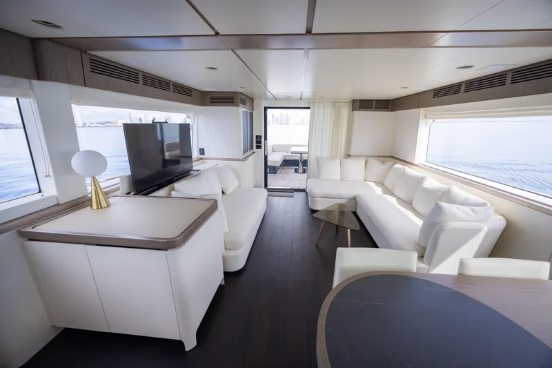 Seahawk Yacht Photos Pics Luxurious interior of 2025 Azimut Magellano 66 yacht with modern furnishings and large windows.