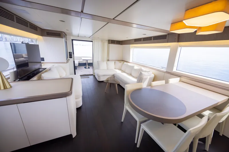 Seahawk Yacht Photos Pics Luxurious interior of 2025 Azimut Magellano 66 yacht with modern furnishings and large windows.