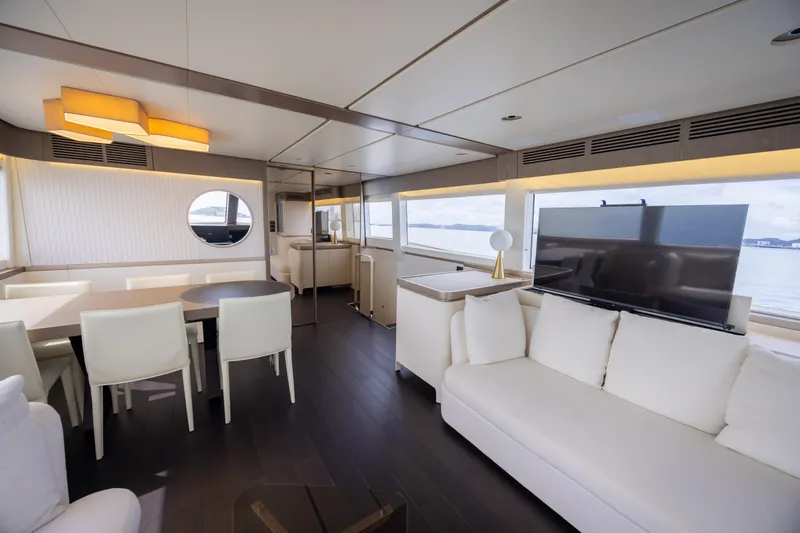 Seahawk Yacht Photos Pics Luxurious interior of 2025 Azimut Magellano 66 yacht with modern furnishings and large windows.