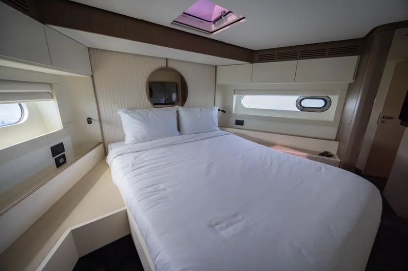 Seahawk Yacht Photos Pics Luxurious bedroom interior of 2025 Azimut Magellano 66 yacht with modern design.