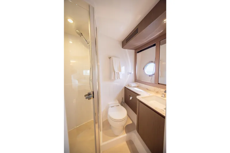 Seahawk Yacht Photos Pics Luxurious bathroom in 2025 Azimut Magellano 66 yacht, featuring modern fixtures and elegant design.