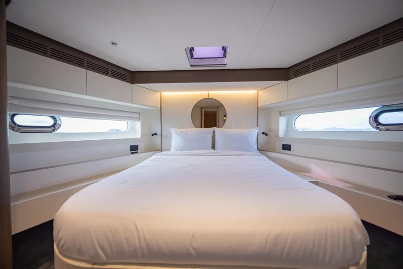 Seahawk Yacht Photos Pics Luxurious bedroom interior of 2025 Azimut Magellano 66 yacht with modern design.