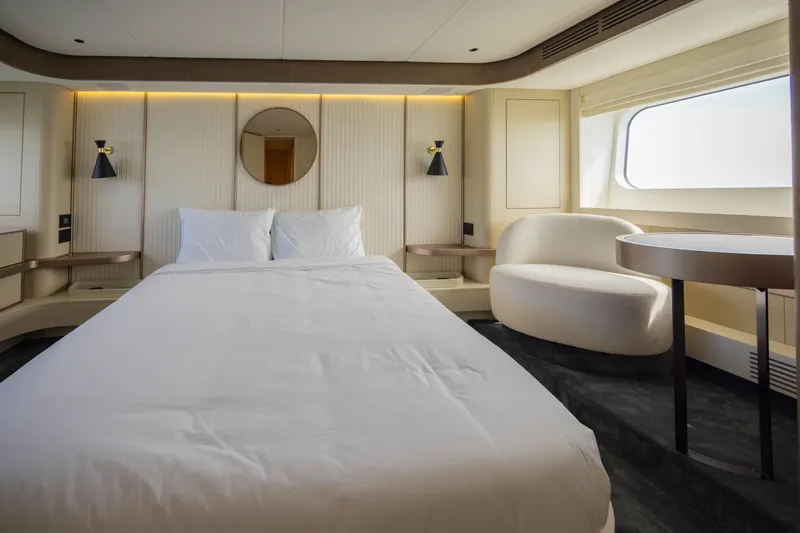 Seahawk Yacht Photos Pics Luxurious bedroom interior of 2025 Azimut Magellano 66 yacht with modern design and elegant furnishings.