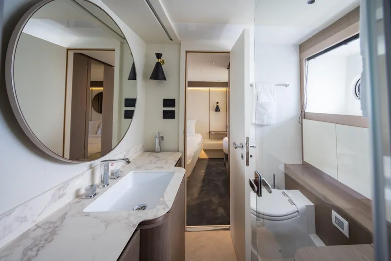 Seahawk Yacht Photos Pics Luxurious bathroom interior of 2025 Azimut Magellano 66 yacht with modern fixtures.