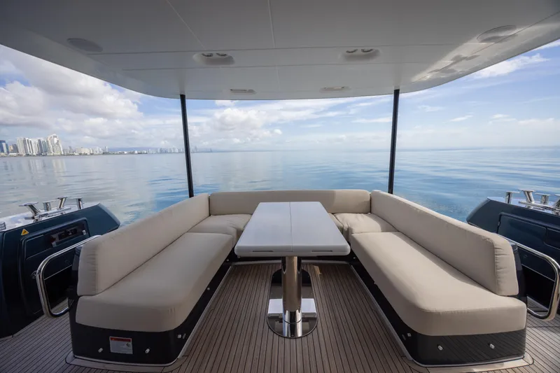 Seahawk Yacht Photos Pics Luxurious 2025 Azimut Magellano 66 yacht deck with elegant seating and ocean view.
