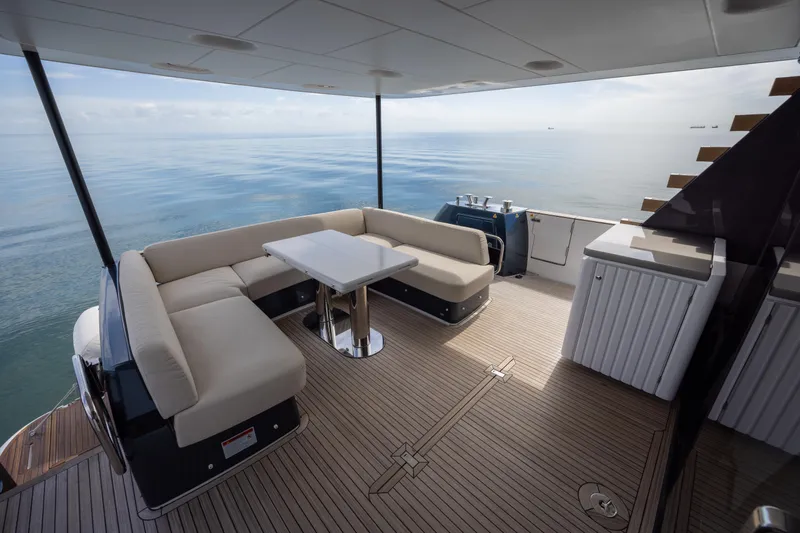 Seahawk Yacht Photos Pics Luxurious 2025 Azimut Magellano 66 yacht deck with elegant seating and ocean view.