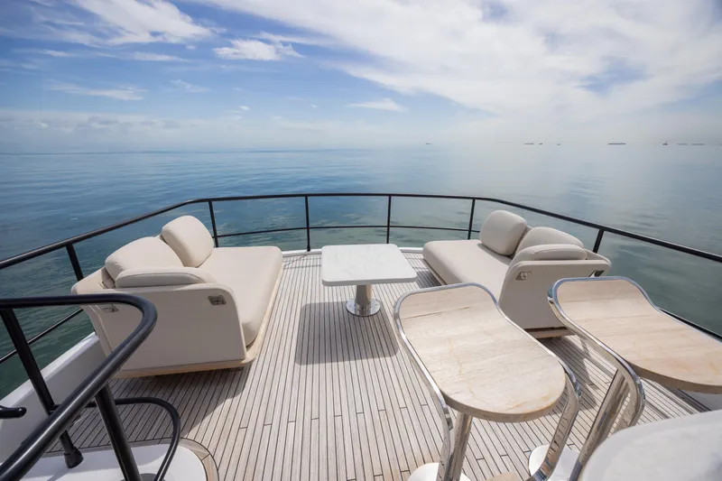 Seahawk Yacht Photos Pics Luxurious deck of 2025 Azimut Magellano 66 yacht with ocean view.